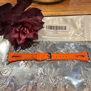 Orange Leather over silicone cutout Apple watch and with silvertone accents. NWT
